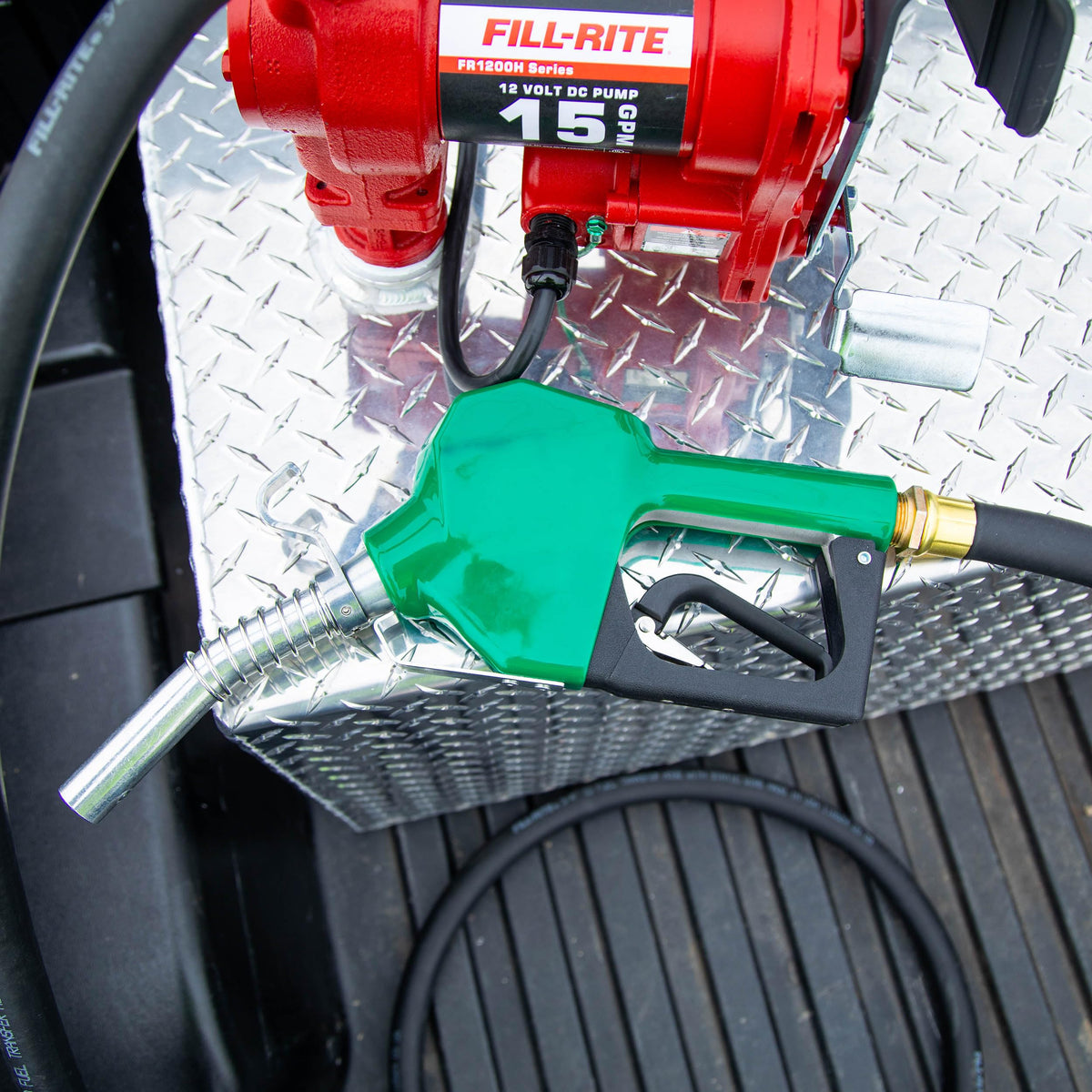 Fill-Rite nozzle size comparison with hand indicating ergonomic grip and scale