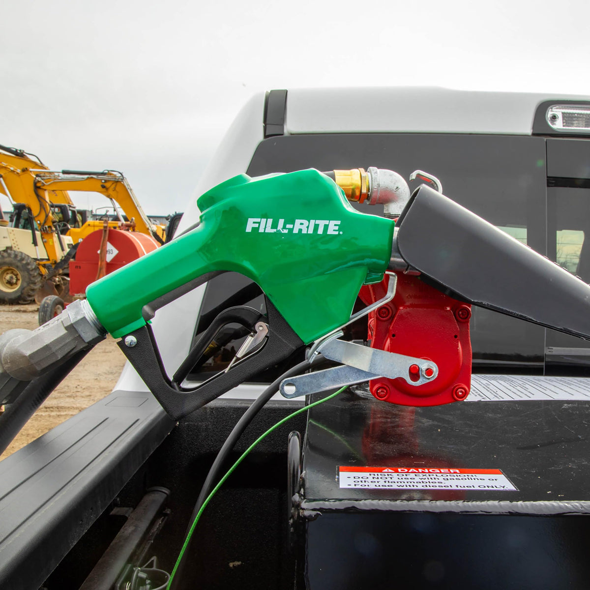 Fill-Rite nozzle in use transferring diesel with automatic shutoff preventing spills
