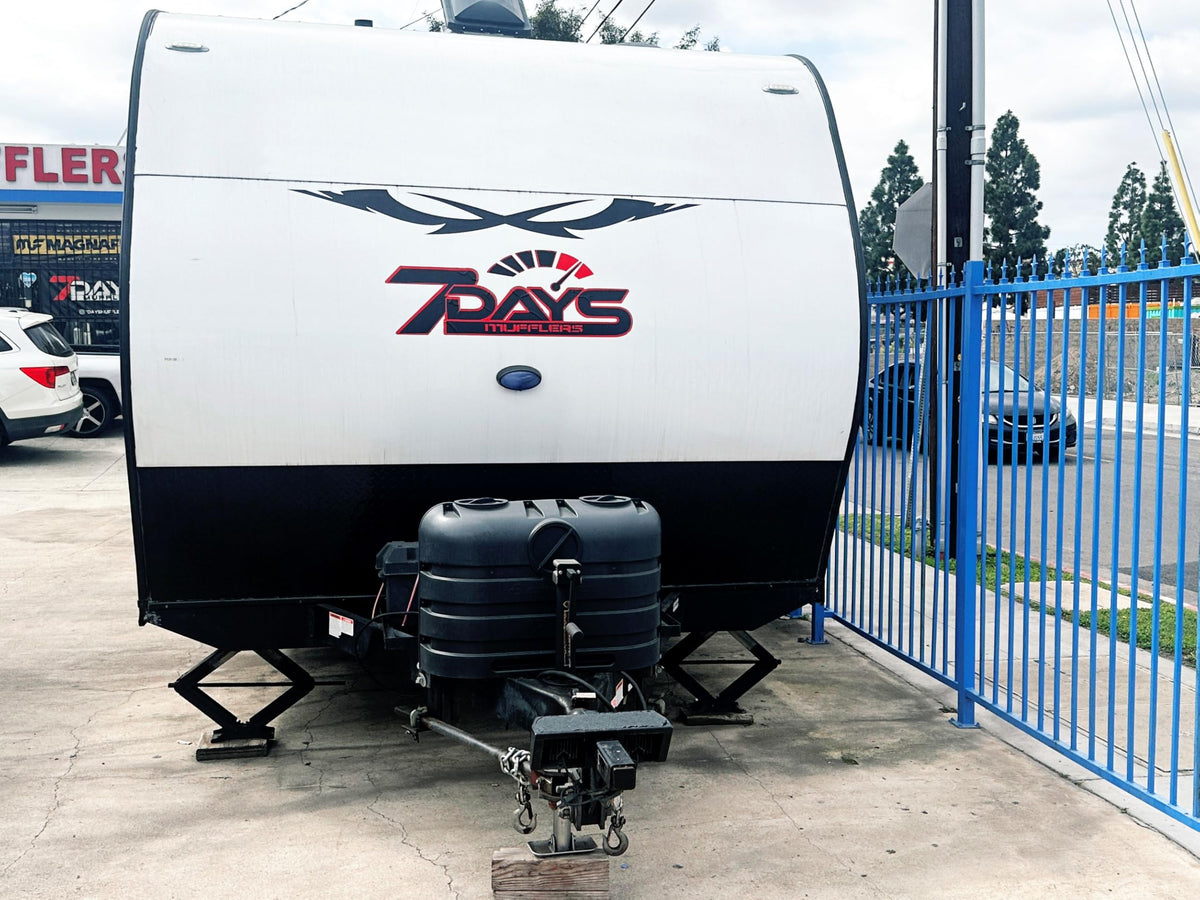 Flame King mounted on RV tongue protecting tanks during travel and use