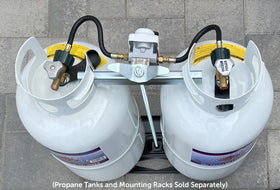 Flame King regulator installed on a camper at a campsite showing uninterrupted propane use