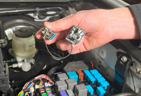 Fleece Performance module installed under hood in Tacoma relay panel demonstrating easy installation