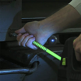 Flexzilla hose in use on machinery showing compatibility with grease guns