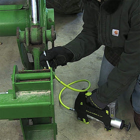 Flexzilla grease hose in use on vehicle to reach confined grease points
