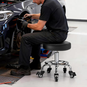FLOLXNB stool tucked under desk demonstrating space-saving fit