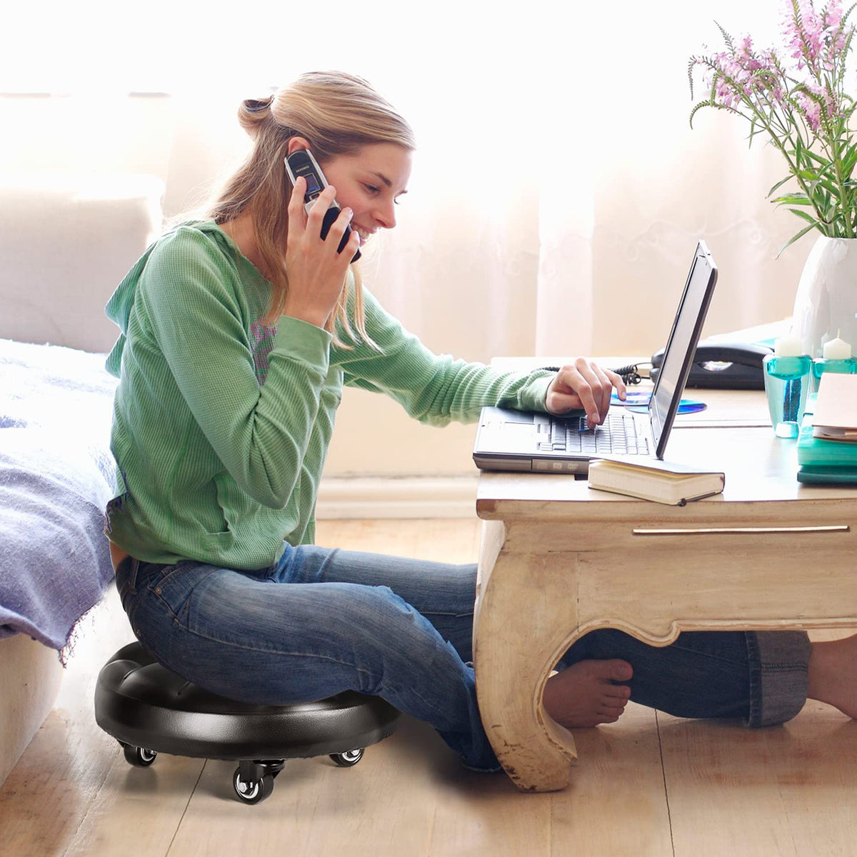 FLOLXNB rolling stool in garage by tool bench improving low-position access and comfort
