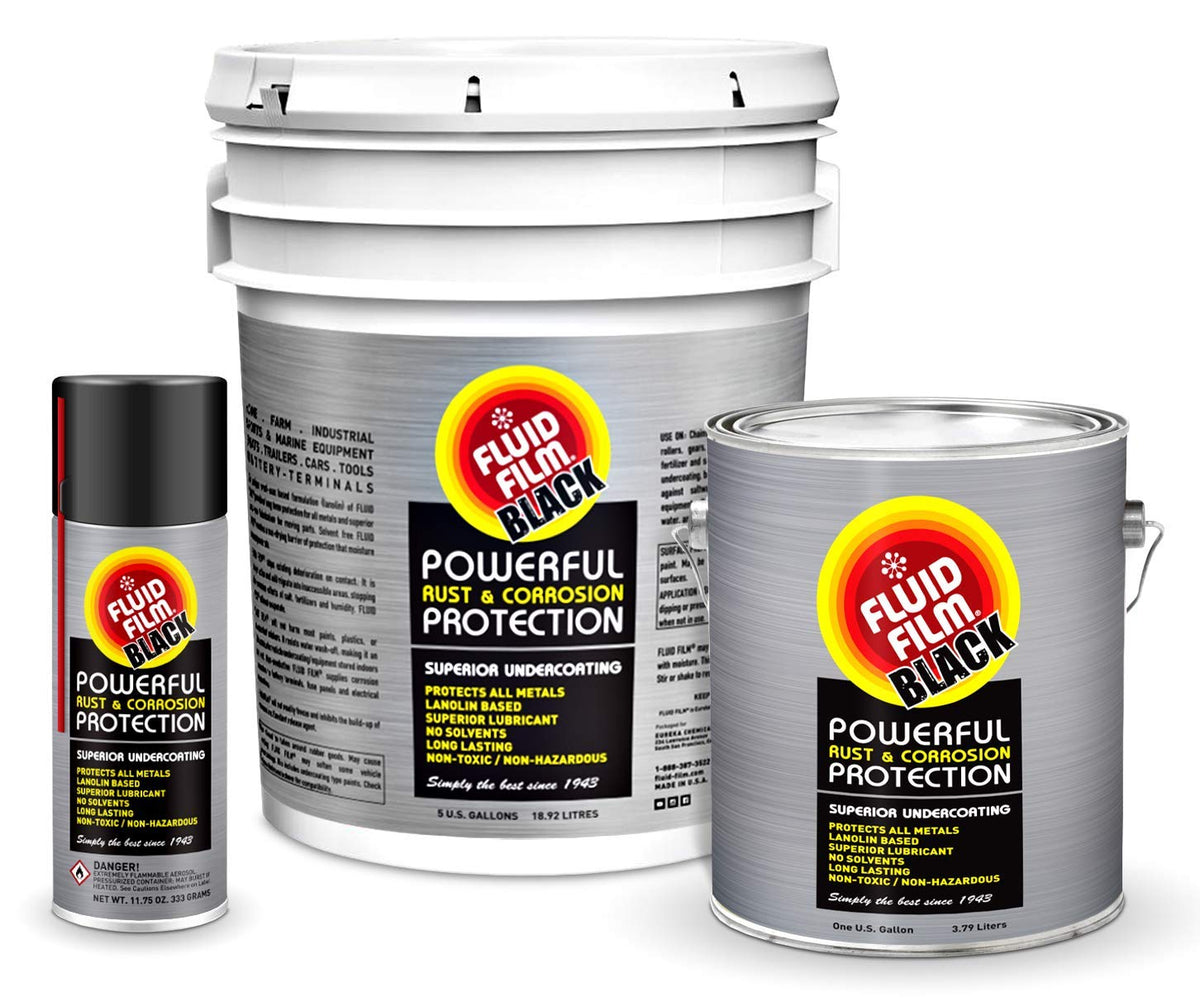 Fluid Film Black aerosol next to hand for scale and easy application