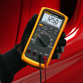 Fluke kit layout with meter and accessories for complete automotive testing convenience