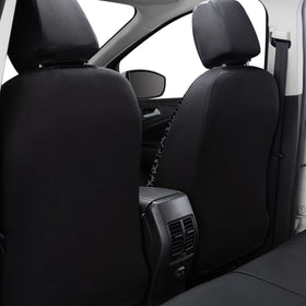 Flying Banner seat cover installed on vehicle front seat, demonstrates fit and airbag compatibility