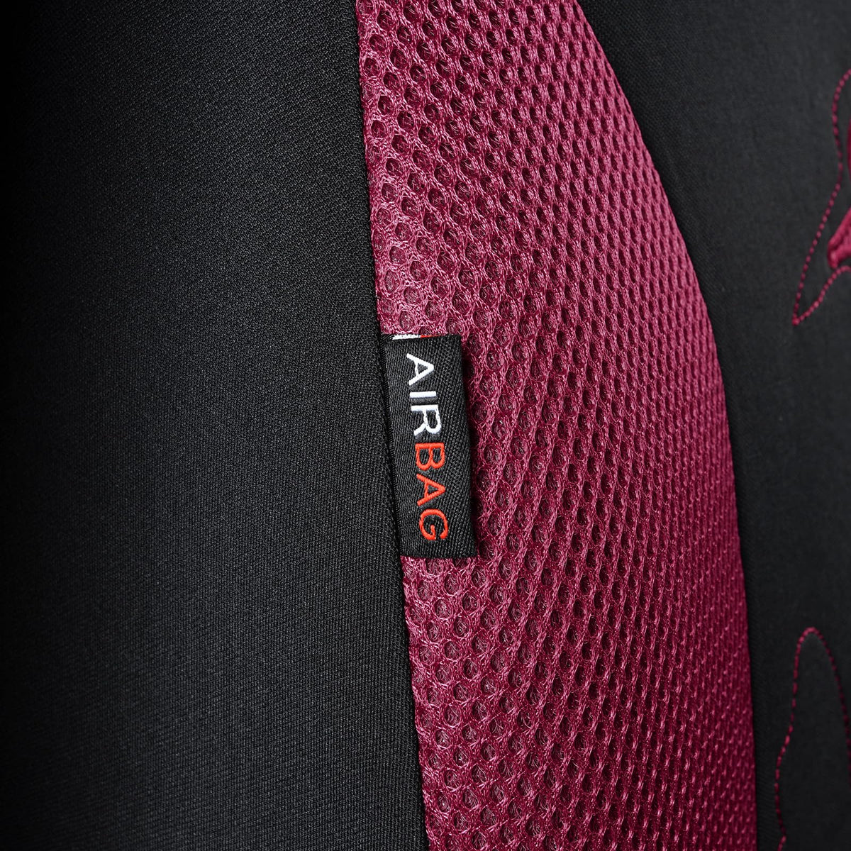 Flying Banner scale comparison on car seat showing universal fit and size clarity