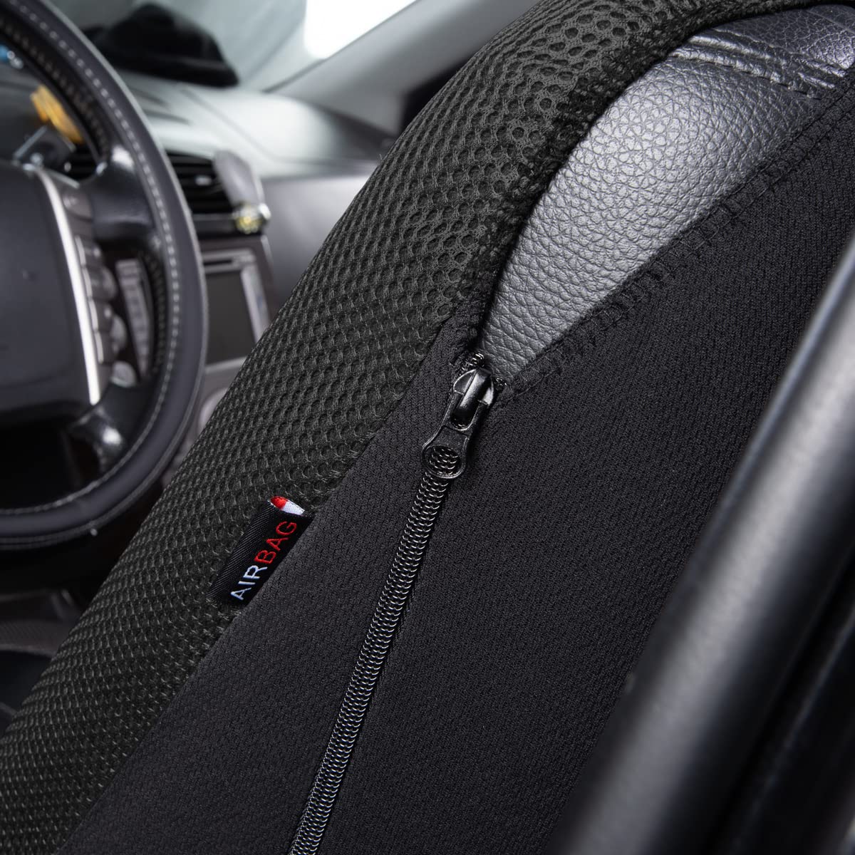 Flying Banner seat cover on seat showing size scale and universal fit benefit