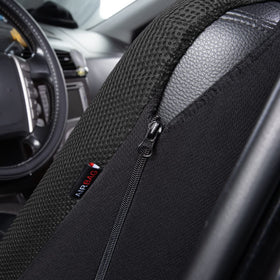 Flying Banner seat cover on seat showing size scale and universal fit benefit