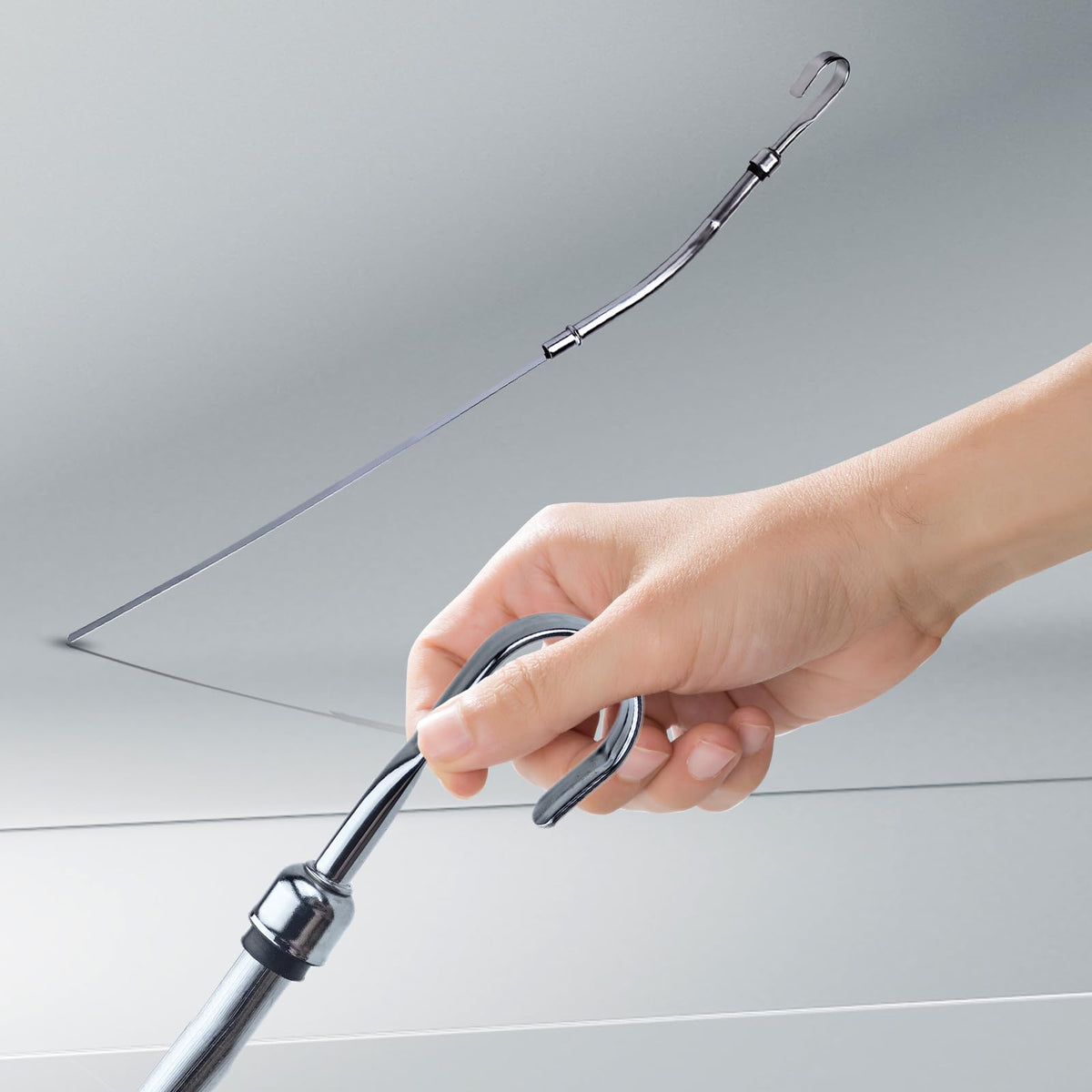 Flylin dipstick in a garage setting illustrating reliable use during maintenance