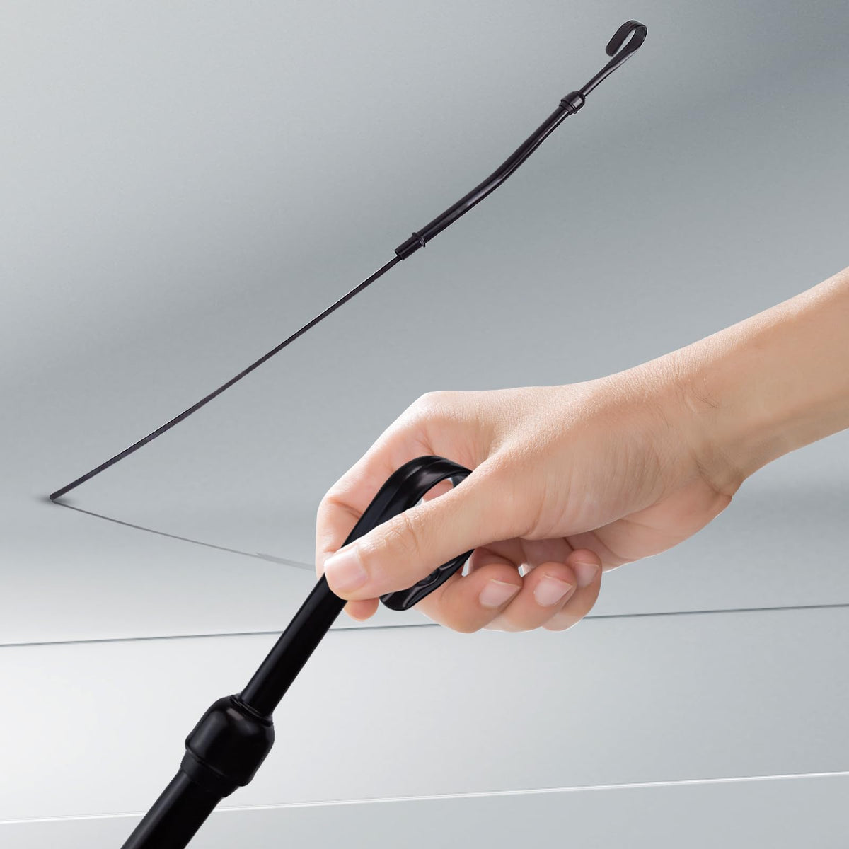 Flylin dipstick next to ruler showing correct length for compatibility benefit