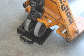 Foghorn chock next to ruler showing 14x12x2 inch scale for fit confirmation