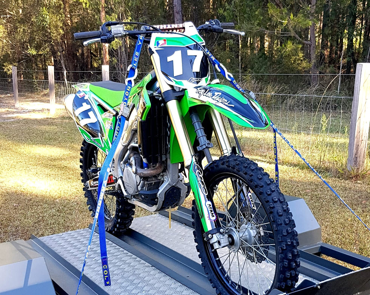 Fork-King installed on adult dirt bike keeping fork stable during transport