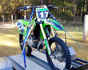 Fork-King installed on adult dirt bike keeping fork stable during transport