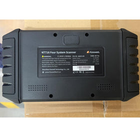 FOXWELL NT716 on garage bench illustrating professional diagnostic workflow