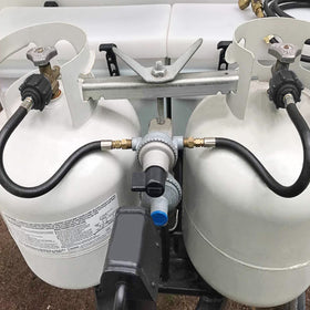 GASPRO hose installed under RV tank cover showing tidy, no-kink connection benefit