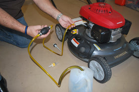 GasTapper hose clip securing hose to reduce spills and mess