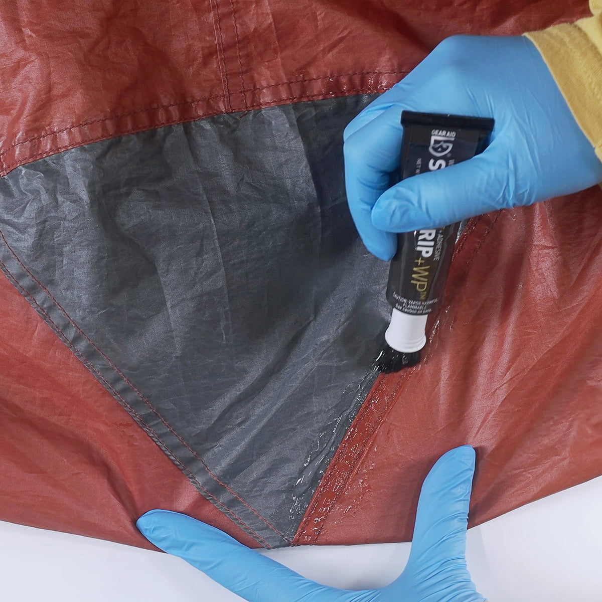 GEAR AID applicator brush close-up for precise, mess-free sealant application
