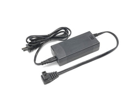 Geckoes AC adapter front view showing compact housing and ventilation for reliable cooling