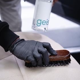 500ml Geist bottle held by hands to show size and easy handling