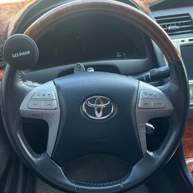 GELINDAF on dashboard in vehicle interior illustrating discreet, ergonomic accessory