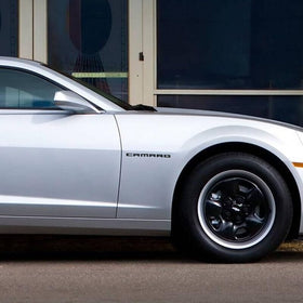 Generic Camaro black ZL1 on driver-side in driveway showing stealthy lifestyle appeal