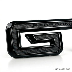 Generic GT emblem on Mustang at night showing blackout aesthetic and visual impact benefit