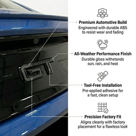 Generic GT emblem held in hand for size scale showing easy peel-and-stick installation benefit