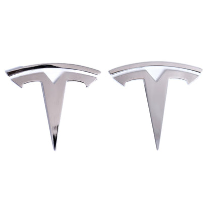 Generic chrome front hood badge on Model Y showing upscale reflective finish