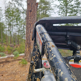 Generic brand mounted on SxS cage tube showing secure clamp and protection for cage finish