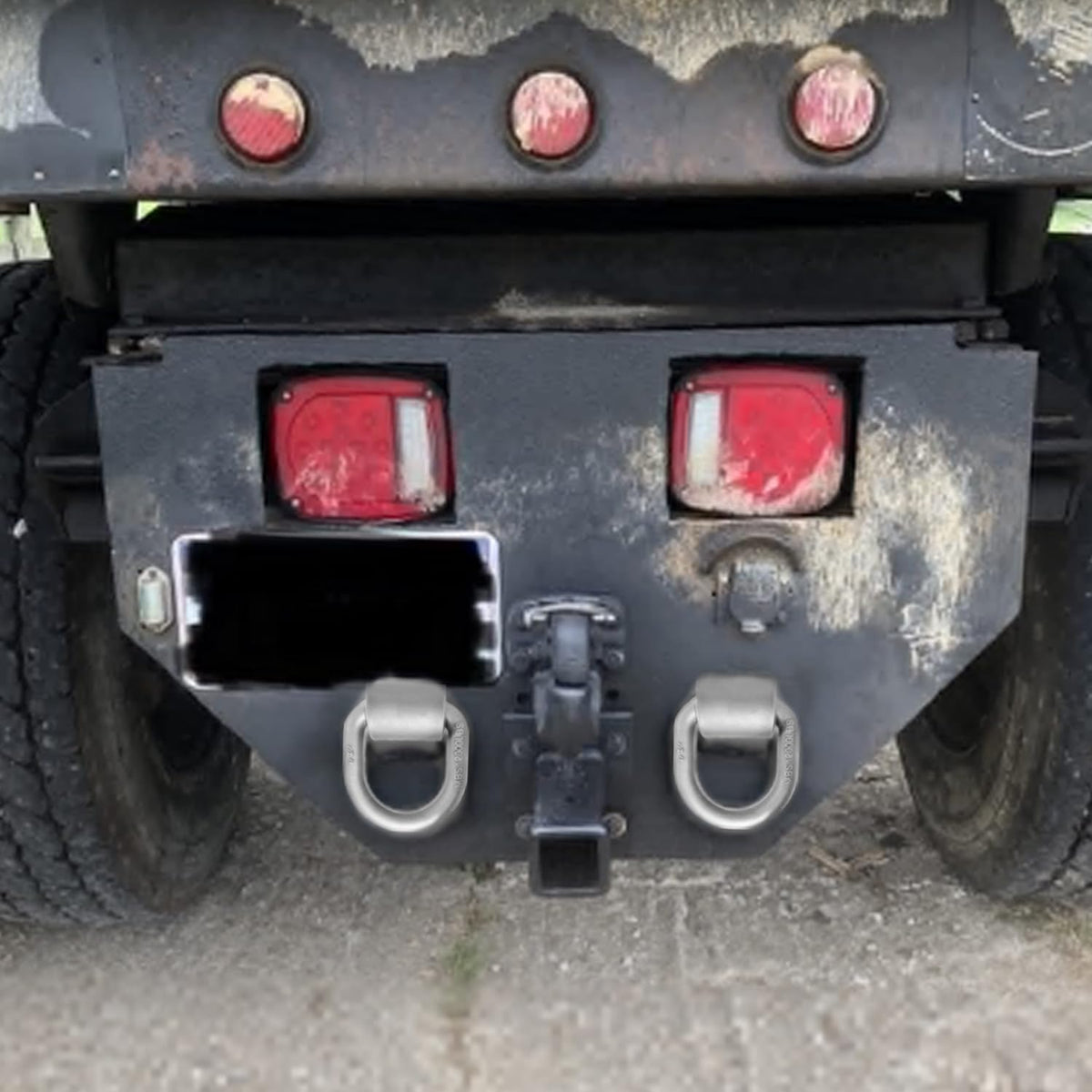 Generic D-ring securing an ATV illustrating practical use and load stabilization benefit