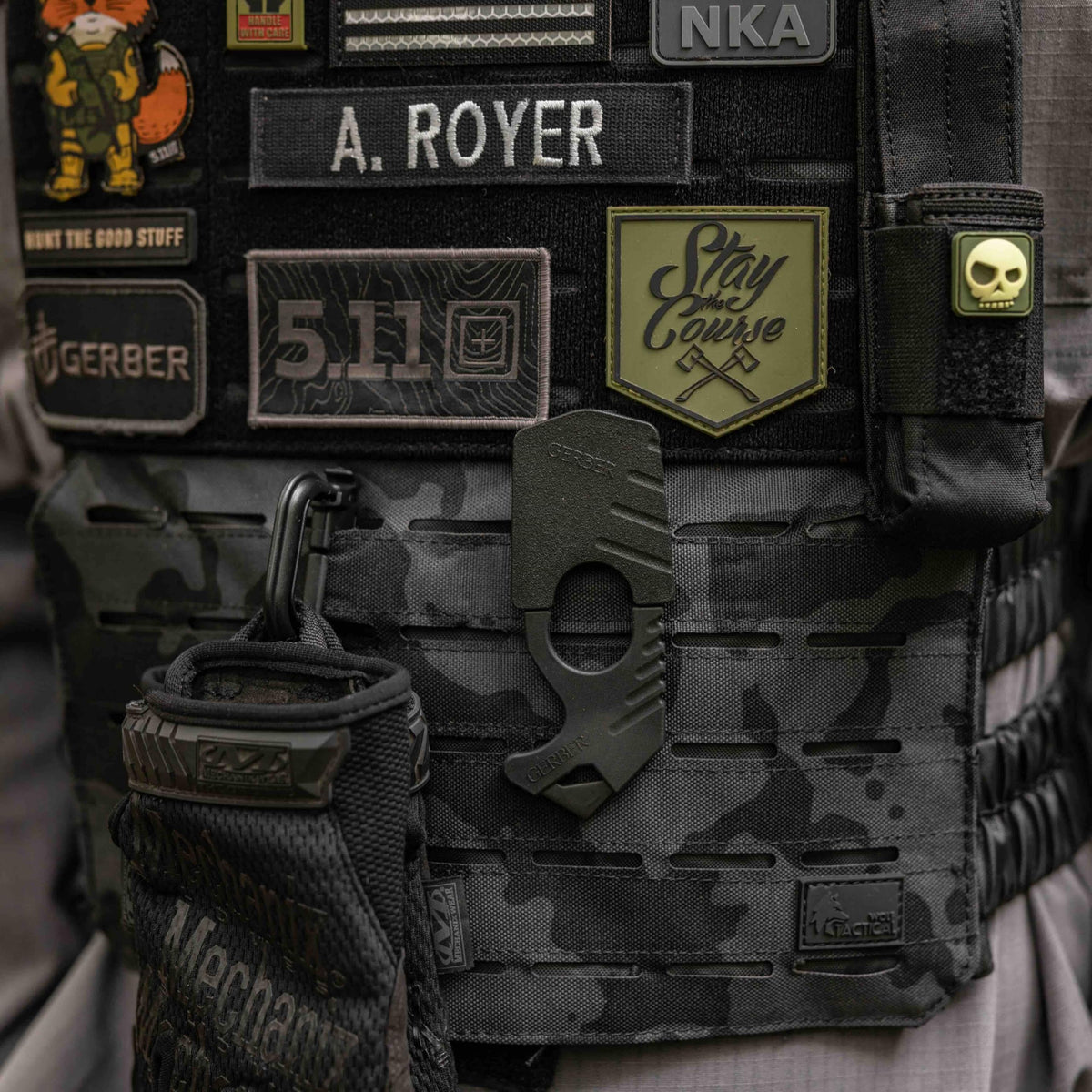 Gerber attached to MOLLE and belt clip showing versatile mounting options