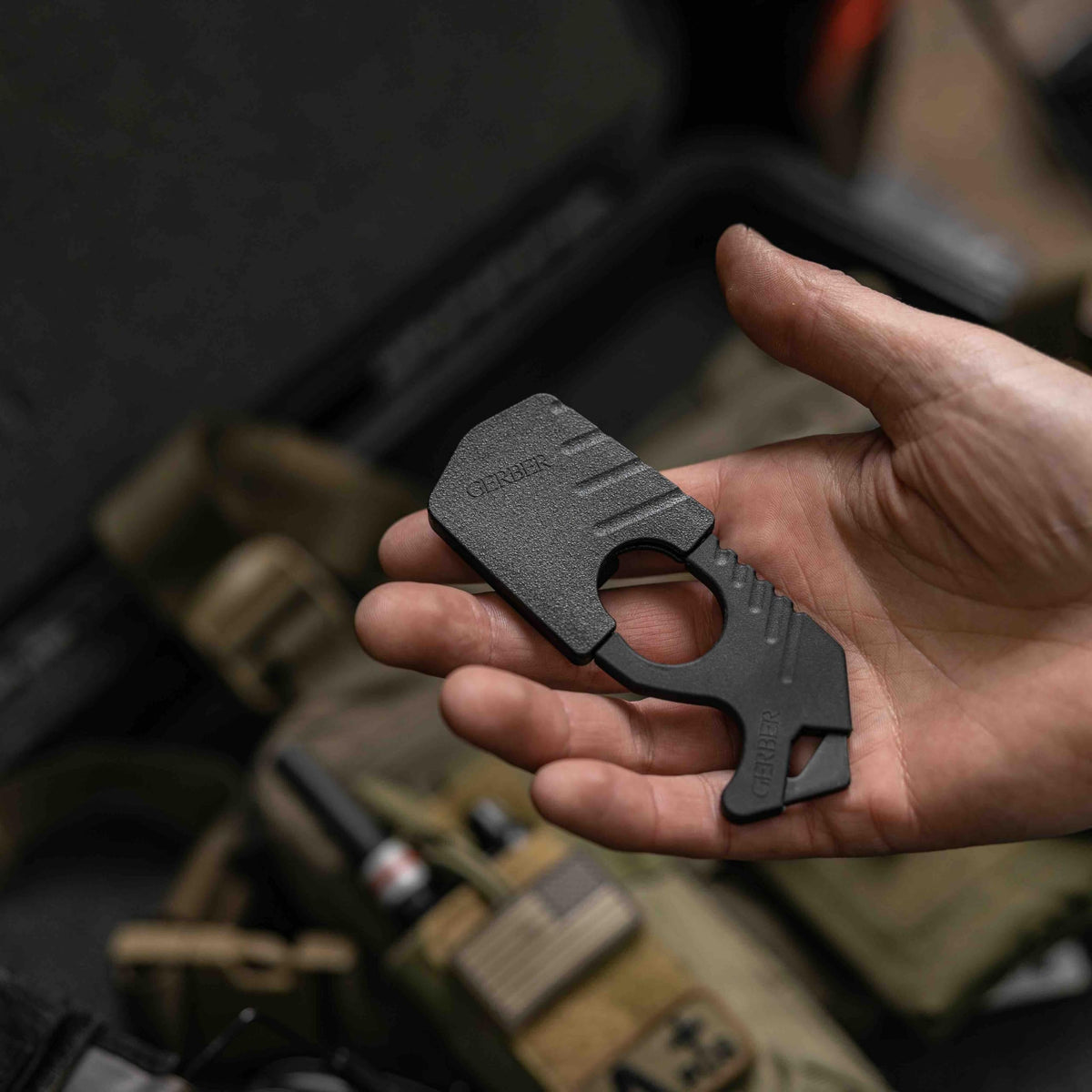 Gerber held near a car window illustrating vehicle escape use case