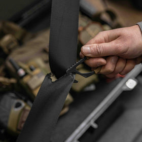 Gerber mounted on MOLLE webbing showing secure attachment on gear