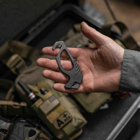 Gerber next to a credit card showing pocket-size scale and portability