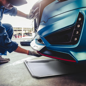 Gisafai tray placed under car catching oil for cleaner maintenance
