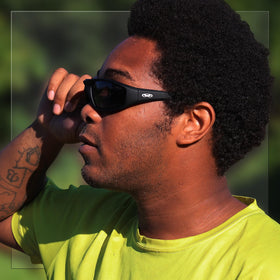 Global Vision lens transitioning from clear to dark demonstrating adaptive glare reduction