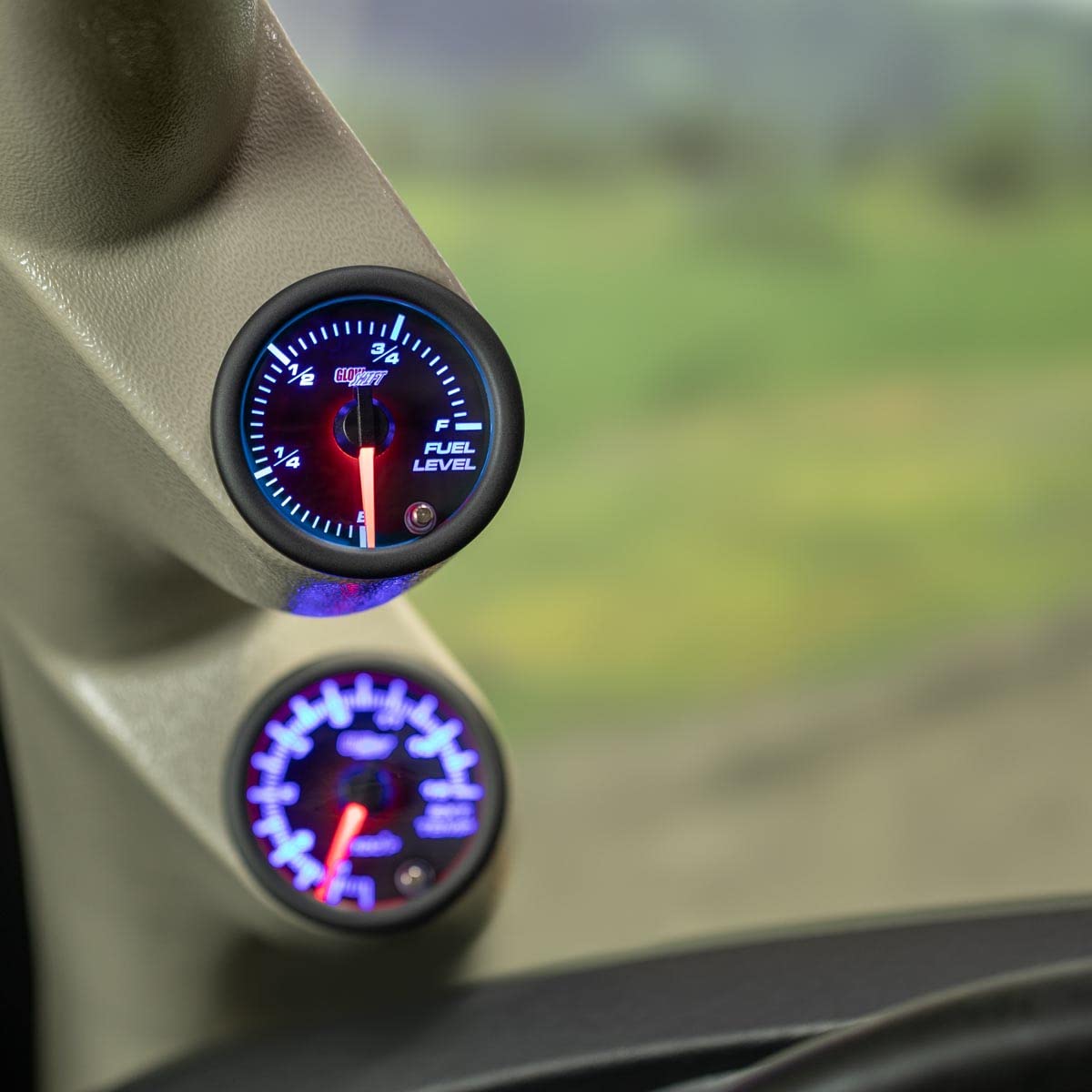 GlowShift lit gauge displaying multiple color modes for interior matching