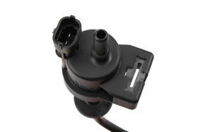 GM Genuine Parts purge valve next to ruler showing compact size for easy replacement