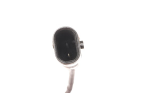 GM GENUINE PARTS sensor installed on brake assembly illustrating correct routing