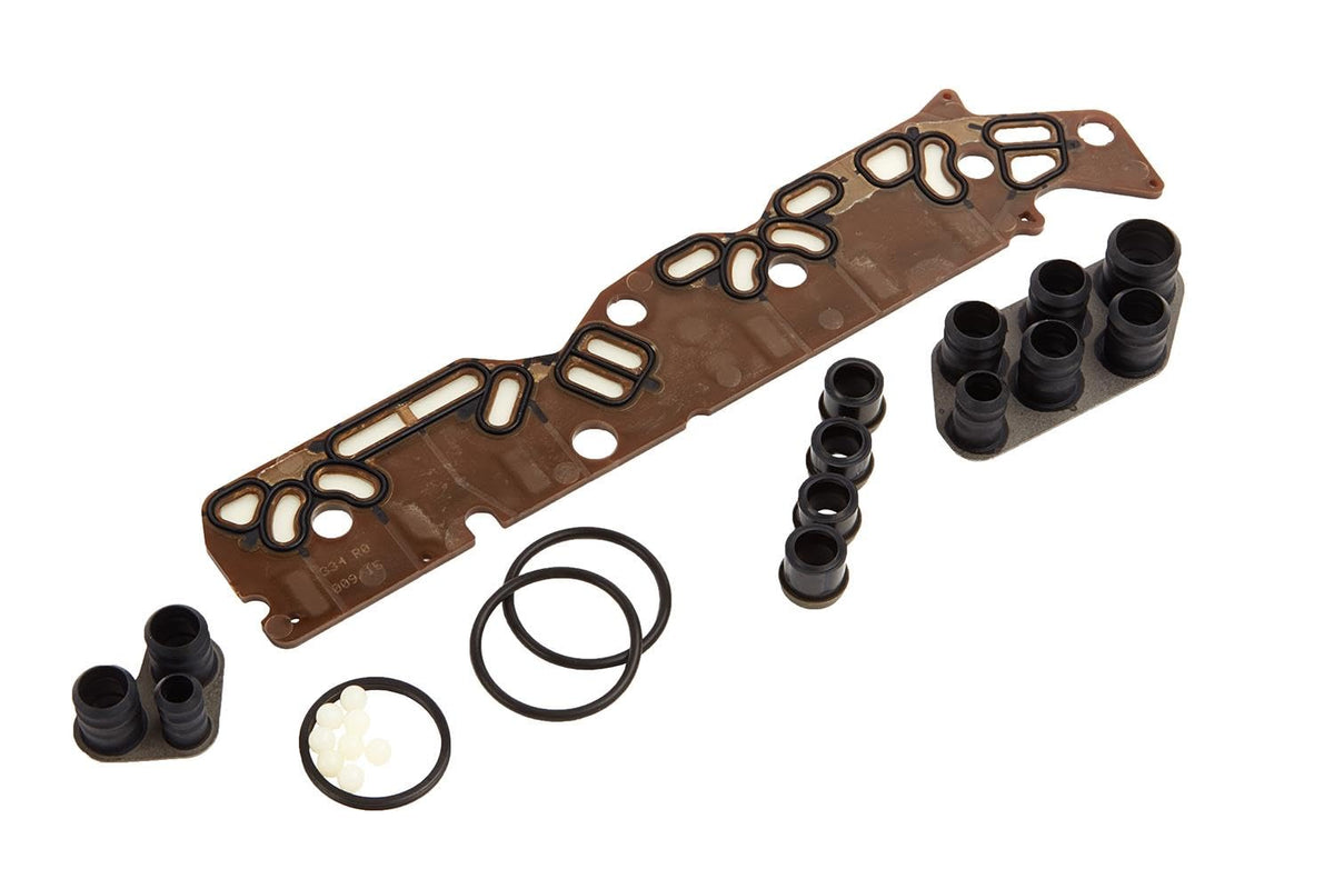 GM Genuine Parts filter plate front view showing clean surface and precise ports for reliable flow control