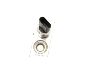 GM Genuine Parts oil cooler hose close-up of material and clamp, highlighting heat-resistant construction