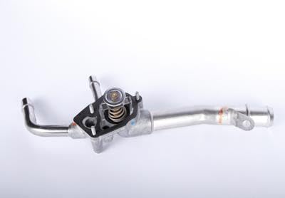 GM Genuine Parts thermostat housing next to ruler for scale demonstrating correct OE dimensions
