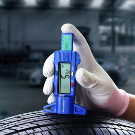 GODESON being used on a car tire to quickly assess tread depth