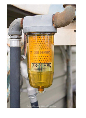Goldenrod filter installed in fuel housing demonstrating easy replacement and safety