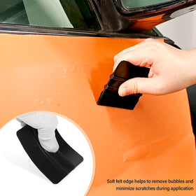 Gomake squeegee applying vinyl wrap on vehicle panel for even adhesion and finish