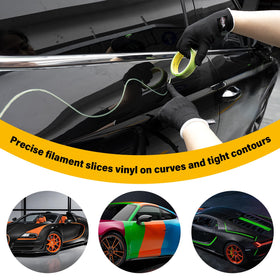 Gomake tape laid on car fender protecting paint while cutting vinyl