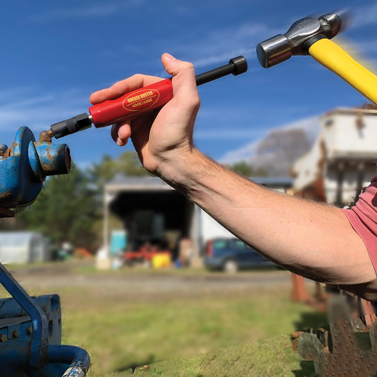 Grease Buster size comparison by Grease Buster next to a hand showing portable maintenance convenience